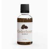 Geurolie cederhout in een heldere glazen fles met zwarte dop voor aromatherapie